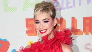 Katy Perry Hilariously Reveals the Perks of Her Unique Red Dress at Stella McCartney Event (Exclusive)