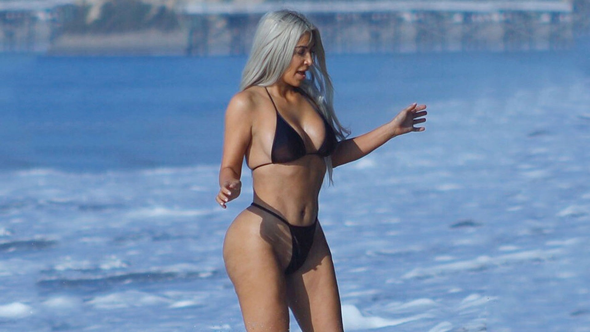 Kim Kardashian Rocks Itty Bitty, Butt-Baring Thong Bikini on the Beach picture