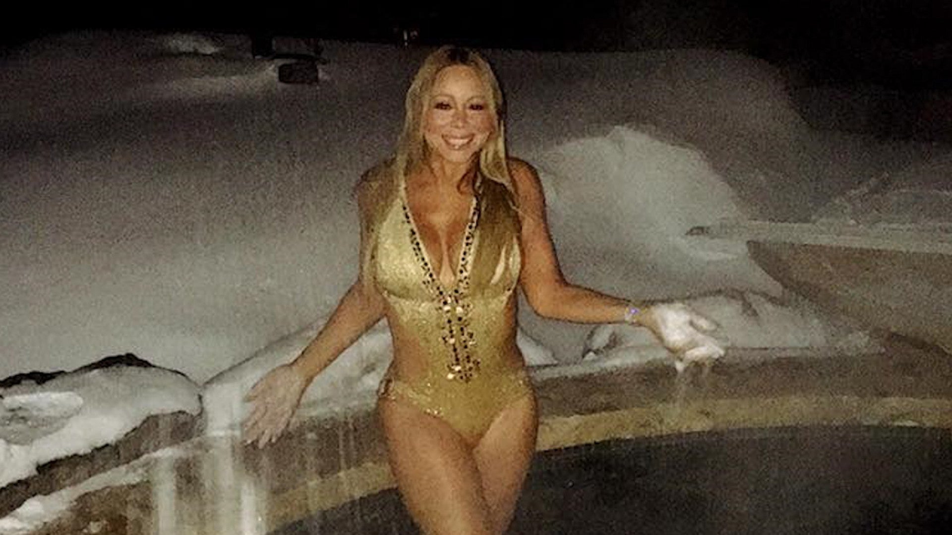 Mariah Carey Strips Down for Sexy, Snow-Covered Swimsuit