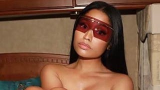 Nicki Minaj Poses Topless, Jokes She's a Stripper
