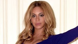 Beyonce Flaunts Growing Baby Bump in Plunging, Figure-Hugging Gown