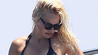 Pamela Anderson Shows Off Toned and Tan Figure in Tiny Black Bikini