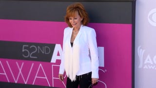 Watch Reba McEntire Hilariously React to Her Throwback Fashions! (Exclusive) 