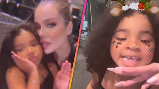 True Thompson Spreads Christmas Cheer -- and Loses Her First Tooth!