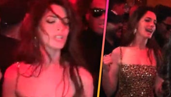 Anne Hathaway’s Dancing Queen Moment Goes Viral at Paris Fashion Week 