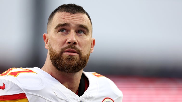 Travis Kelce #87 of the Kansas City Chiefs looks on without his helmet on the way to the locker room during halftime against the New England Patriots at Gillette Stadium on December 17, 2023 in Foxborough, Massachusetts.