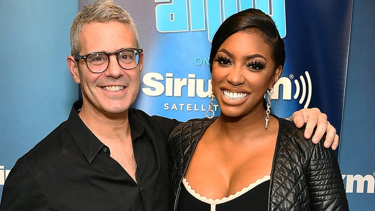 Andy Cohen and Porsha Williams pose for photos at Radio Andy SiriusXM Studios on April 29, 2019 in New York City.