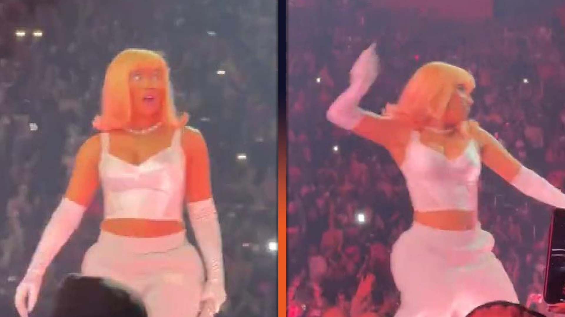 Watch Nicki Minaj throw an object back at fans who threw it at her during a concert