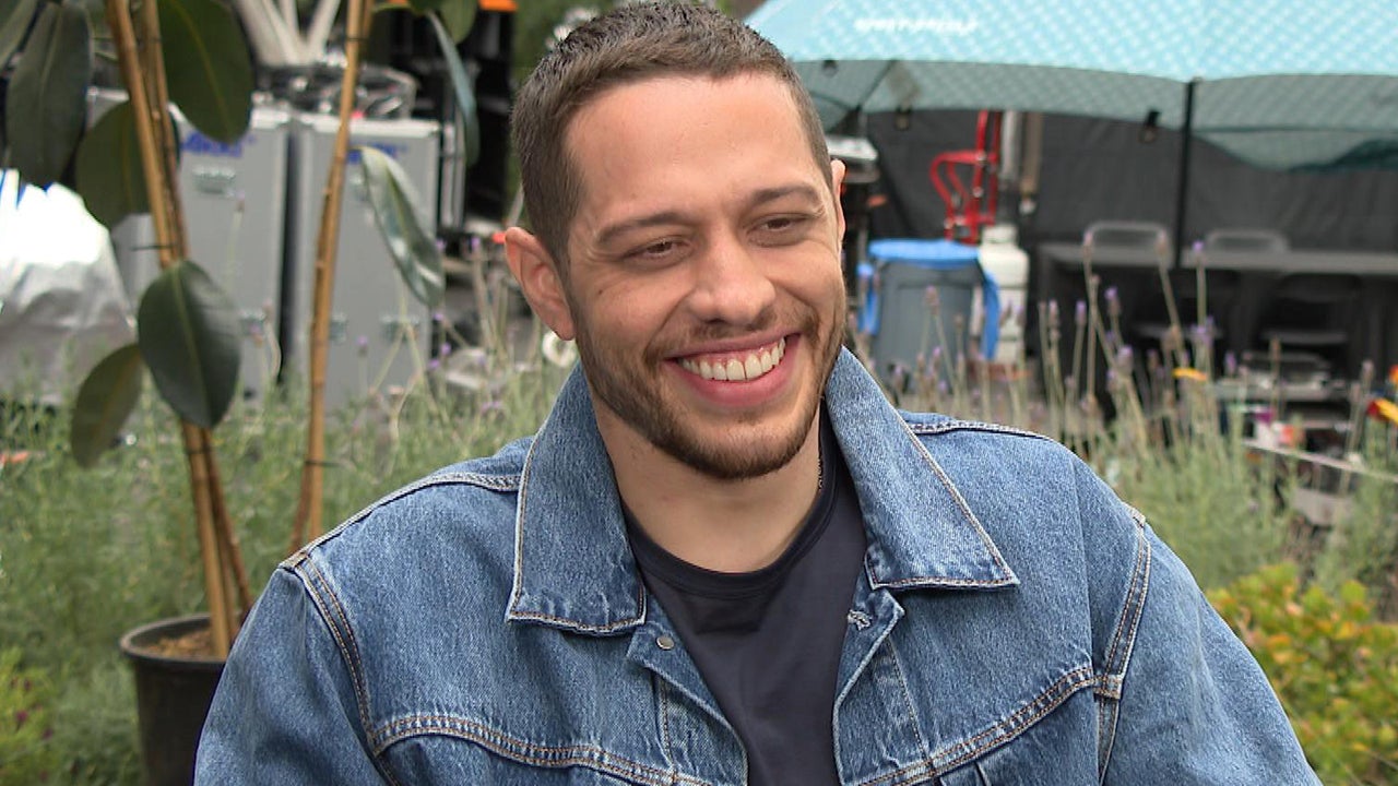 Pete Davidson smiling in a denim jacket during an Entertainment Tonight interview