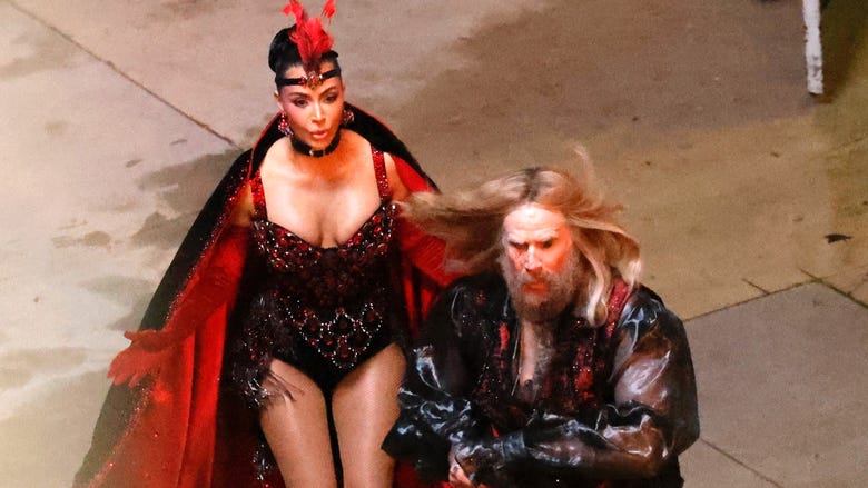 Kim Kardashian Chases a Bearded Will Ferrell While Dressed as a Vegas Showgirl